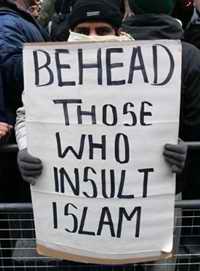 Protester with placard: Behead those who insult Islam